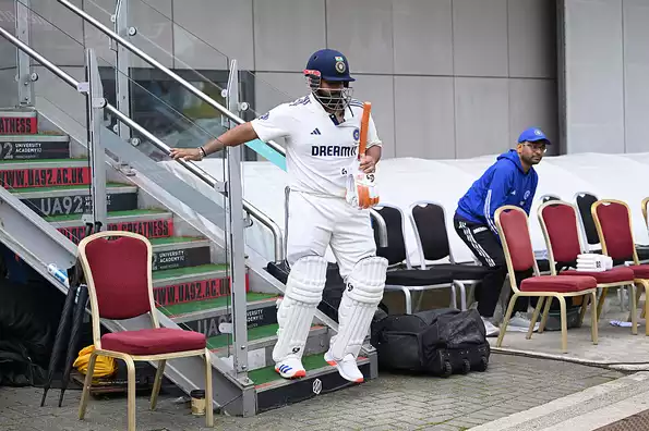 Rishabh Pant assisted off the field after injury.